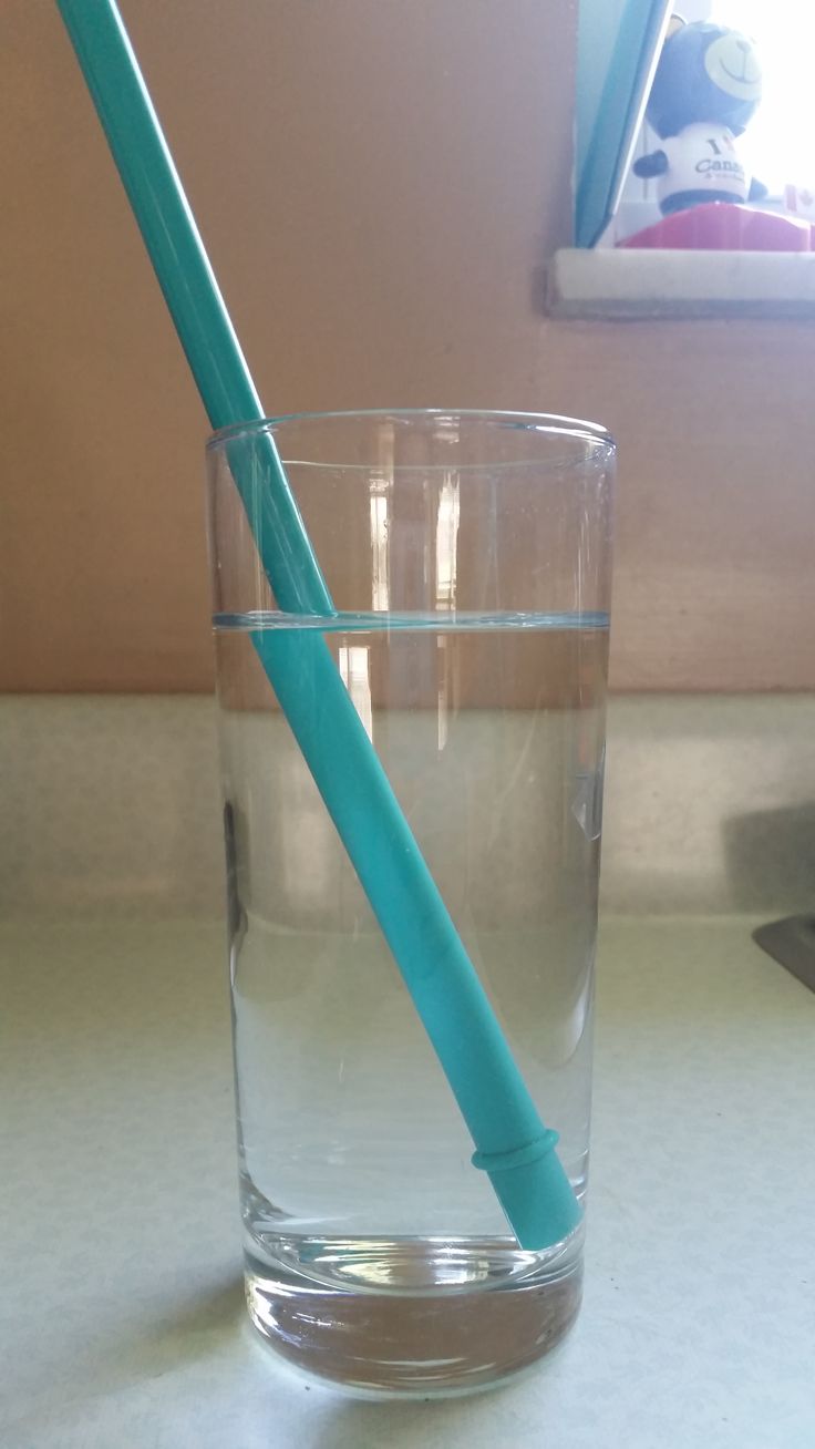 Straw appearing bent in a glass of water due to refraction of light