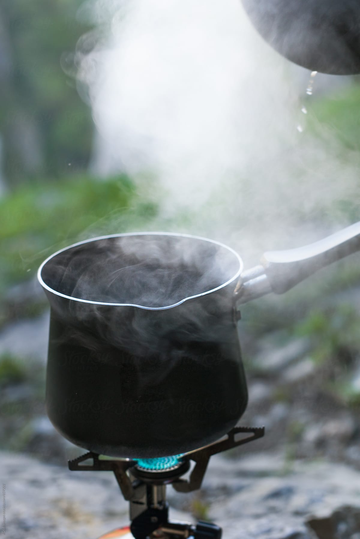 Steam rising from boiling water, carrying away latent heat of vaporisation