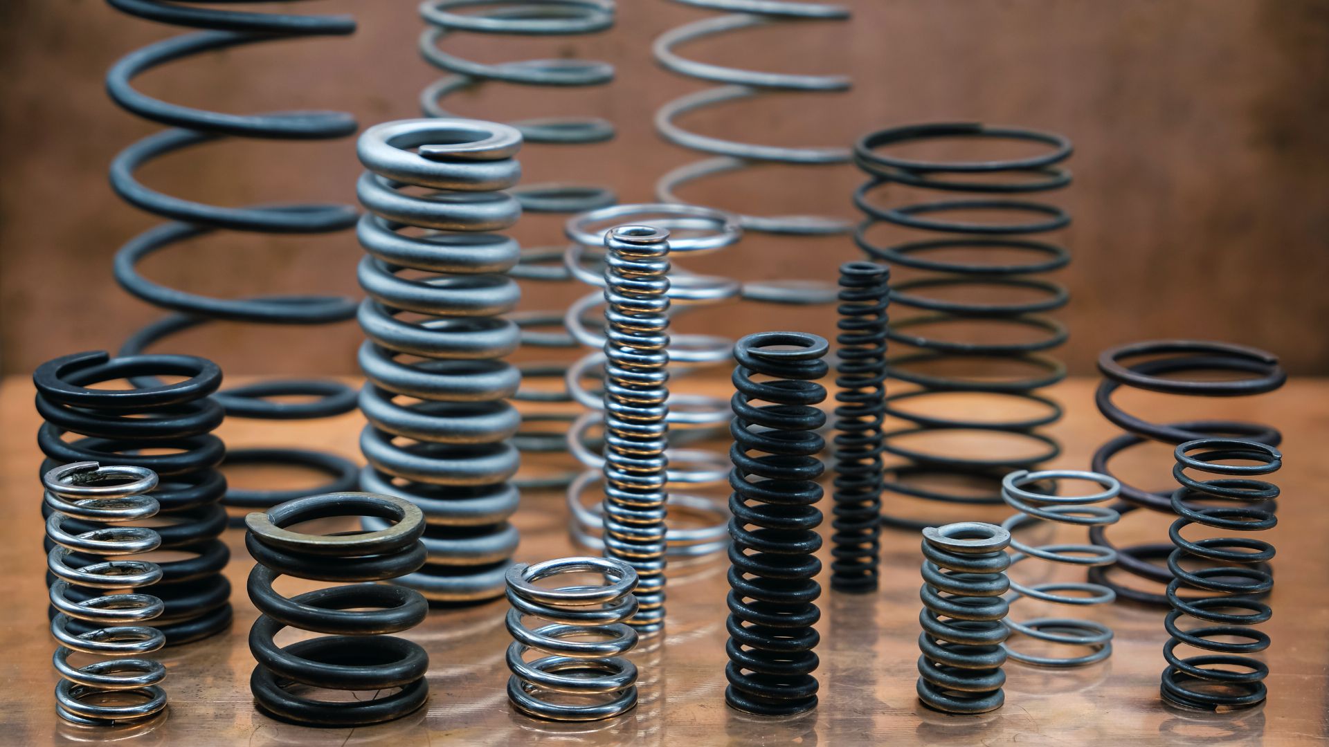 Metal coil spring demonstrating Hooke's Law extension under load