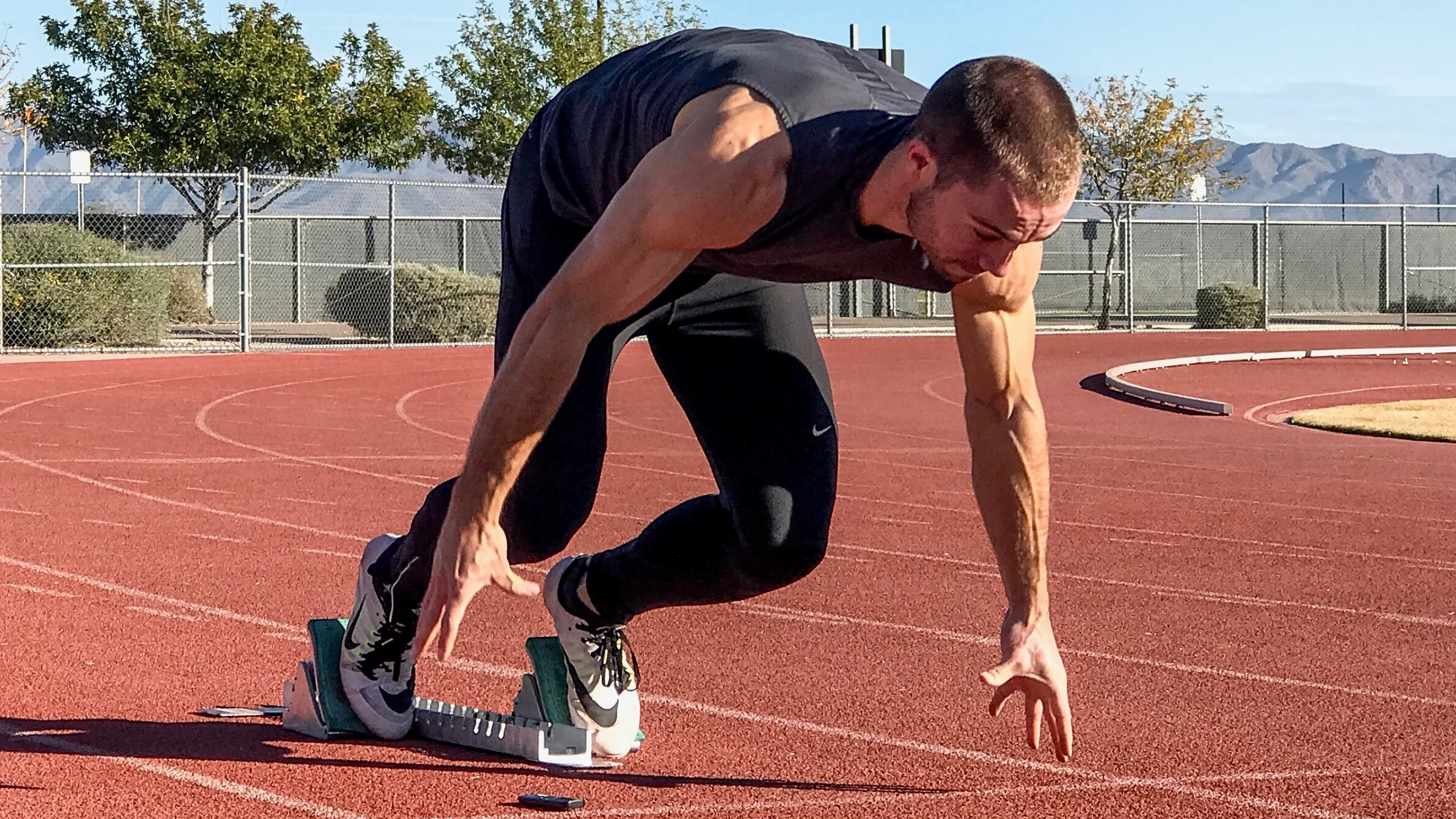 Sprinter accelerating off the starting blocks — real-world acceleration in physics