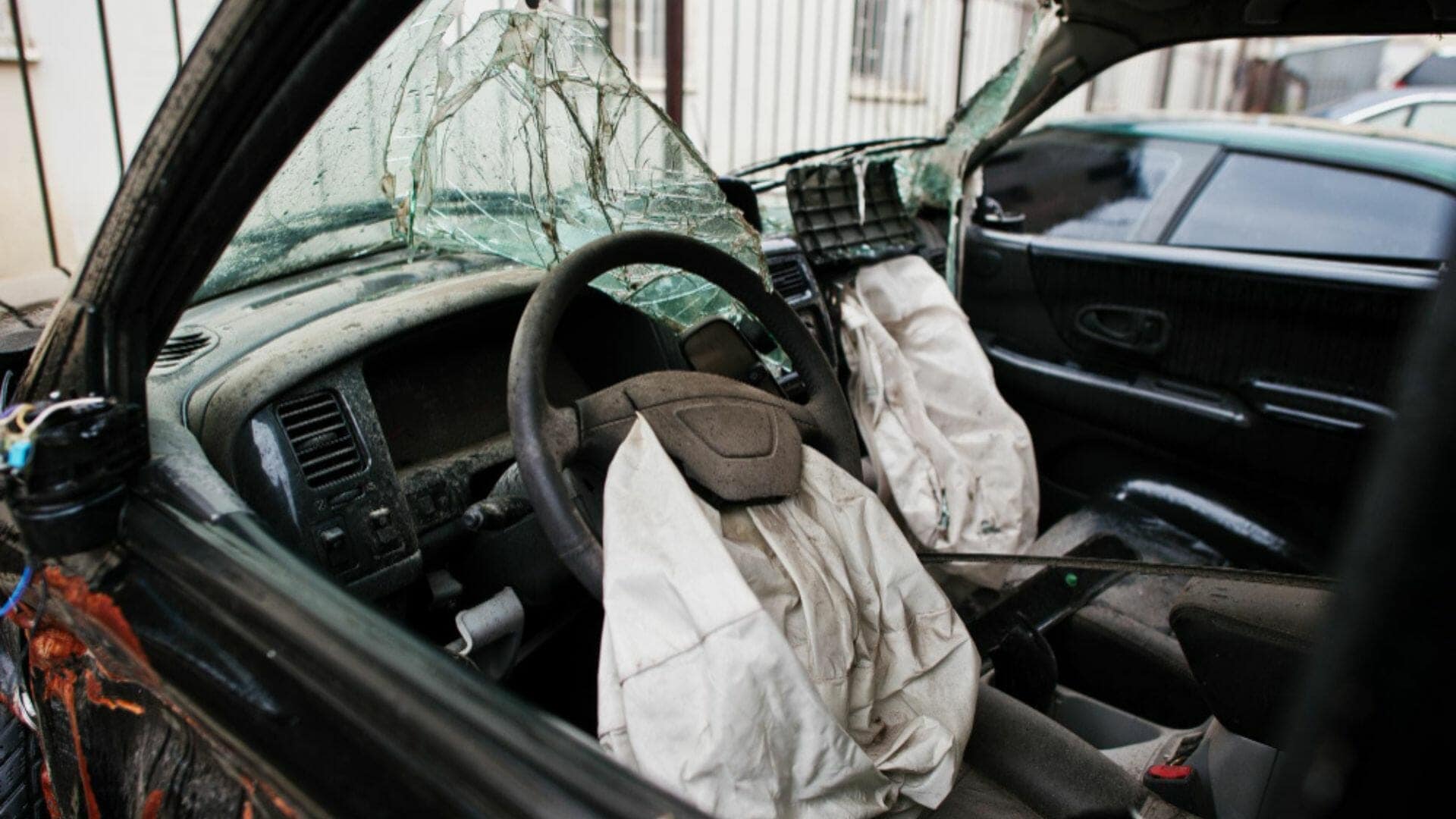Airbag deploying in a crash test, extending the impulse time to cut peak force