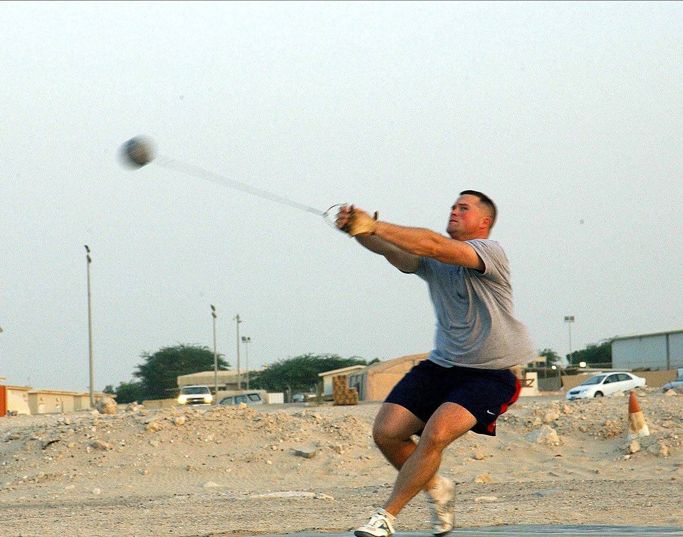 Hammer thrower spinning, showing the centripetal force from the wire before a tangential release