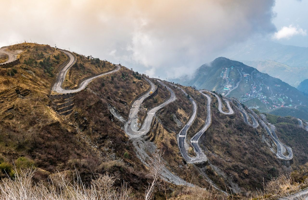 Mountain switchback road applying inclined plane physics to cut the ramp angle on a steep climb
