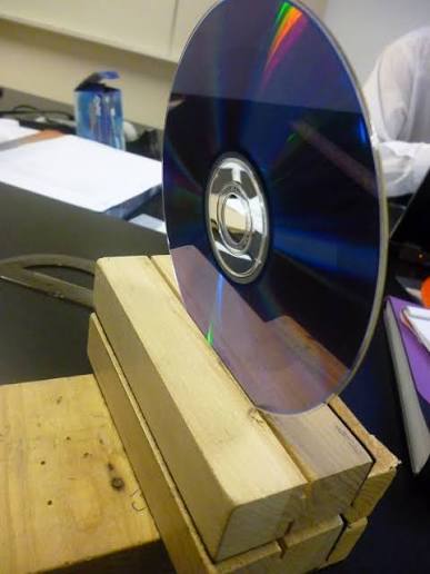 Diffraction physics in action: a laser beam split into bright ordered spots by a diffraction grating