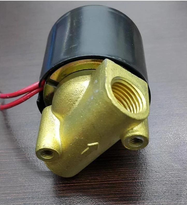 Cutaway of a solenoid valve showing the wire coil and the iron plunger it pulls