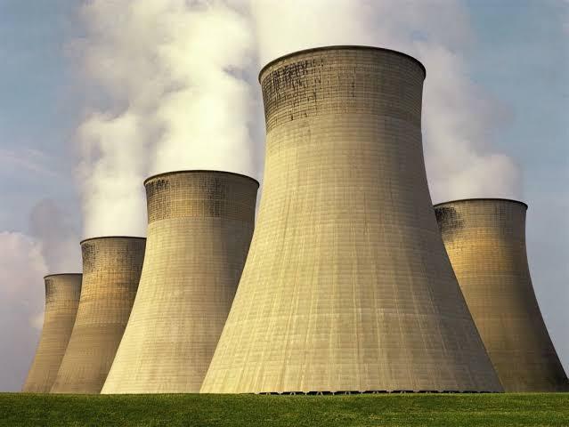 Cooling towers rejecting waste heat, the cold reservoir that sets Carnot efficiency