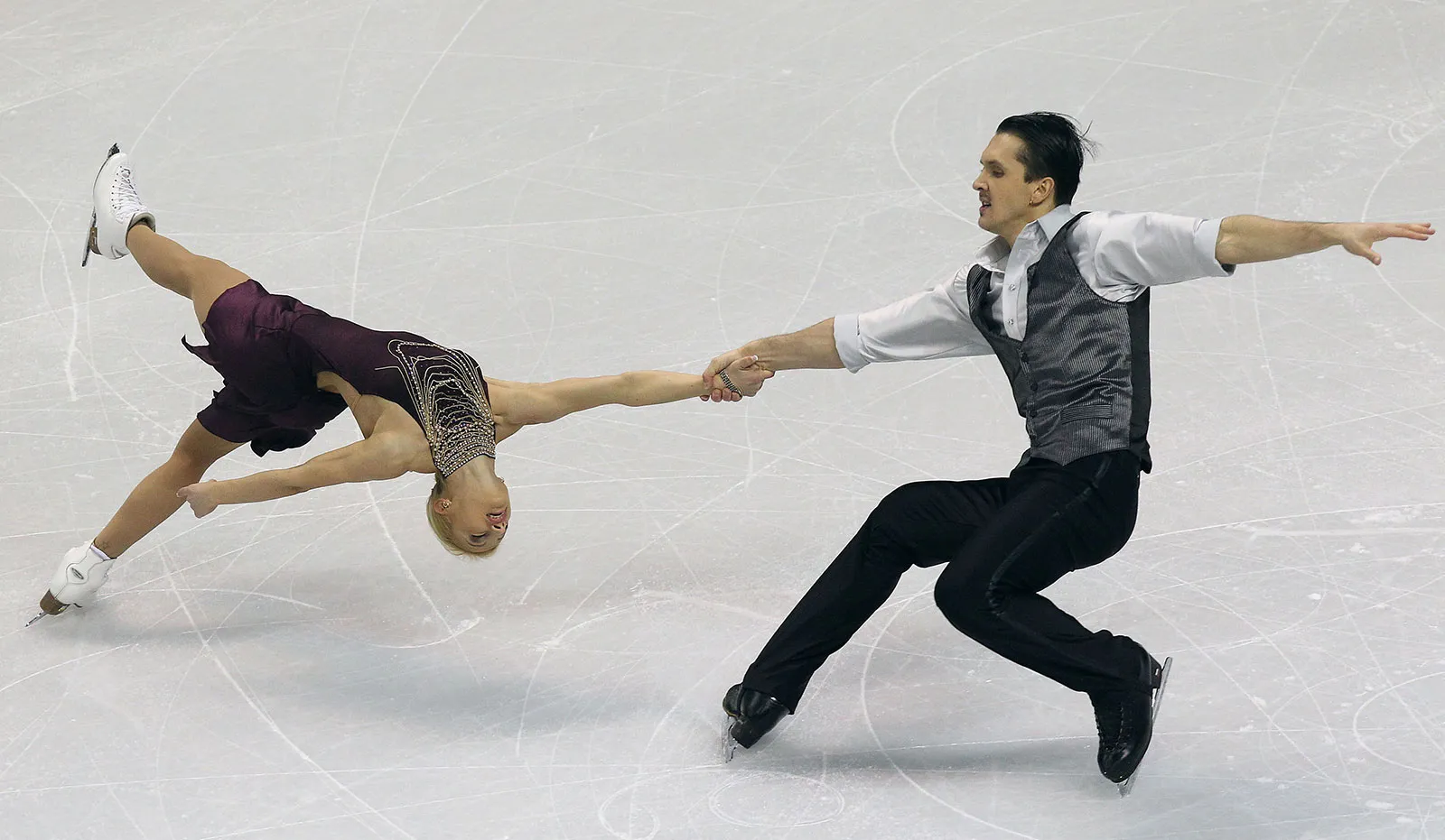 Figure skater spinning with the arms pulled in, the classic everyday example of angular momentum conservation